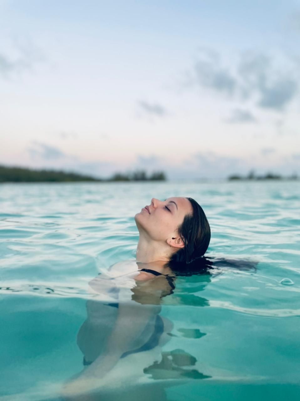 woman enjoying the water in the beaches of cozumel